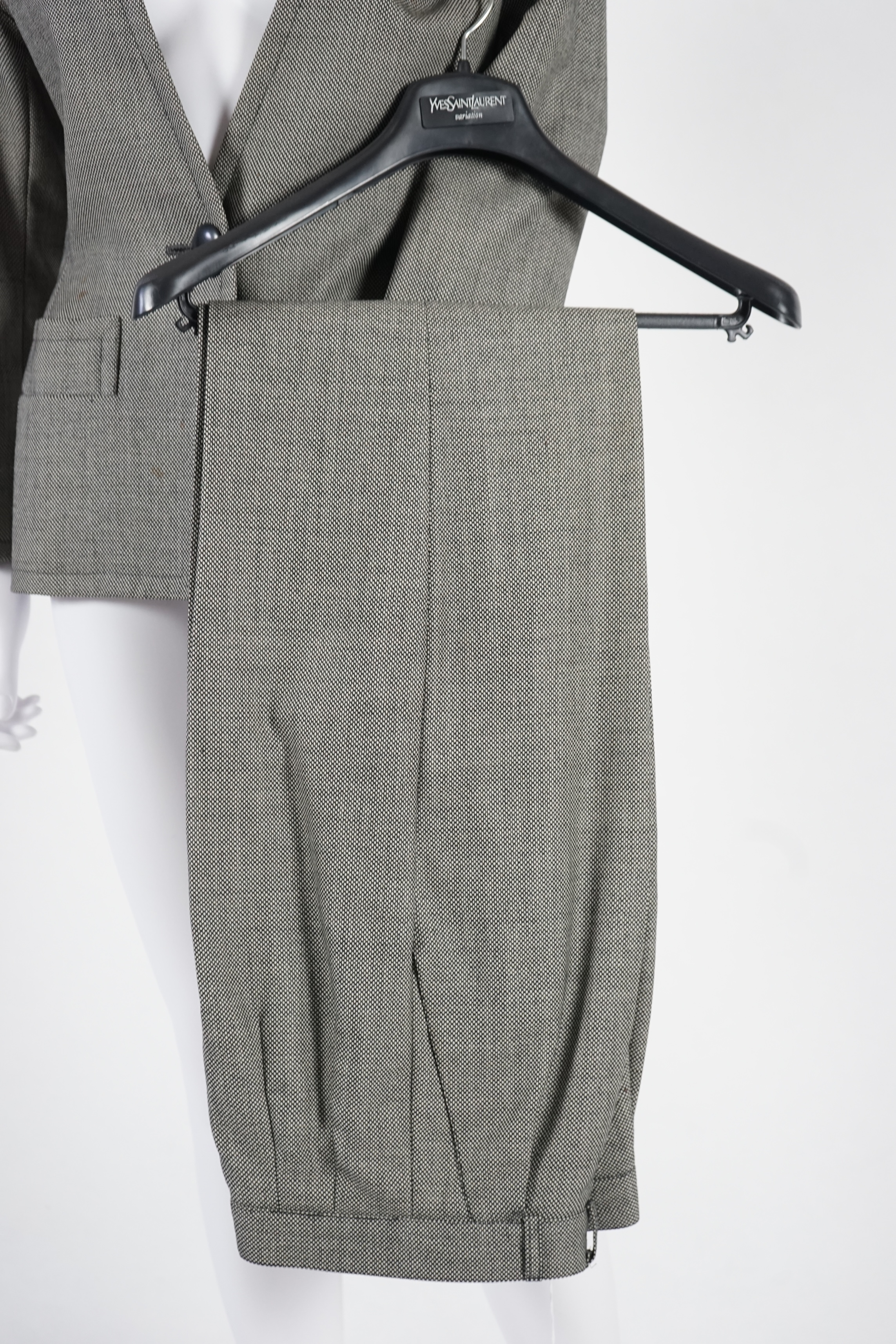 Two vintage Yves Saint Laurent variation lady's suits with matching trousers and skirts, F 40 (UK 12). Please note alterations to make the waist smaller may have been carried out on some of the skirts. Proceeds to Happy